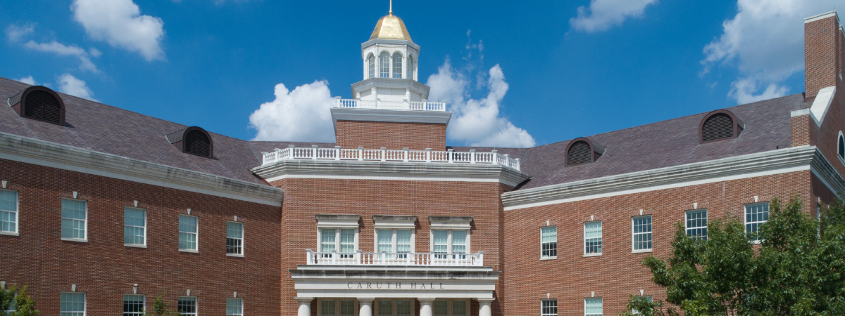 A view of the golden peak of Caruth Hall at the SMU Lyle School of Engineering on a sunny day