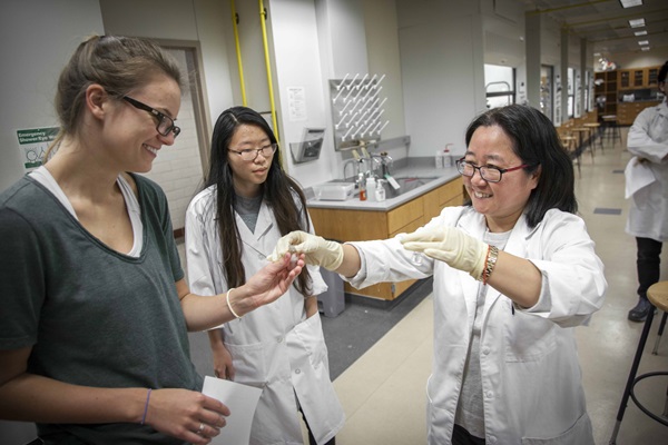 student with fossils