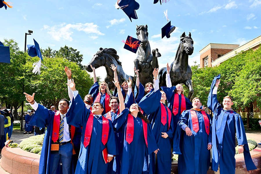 Graduates tossing their caps in the air