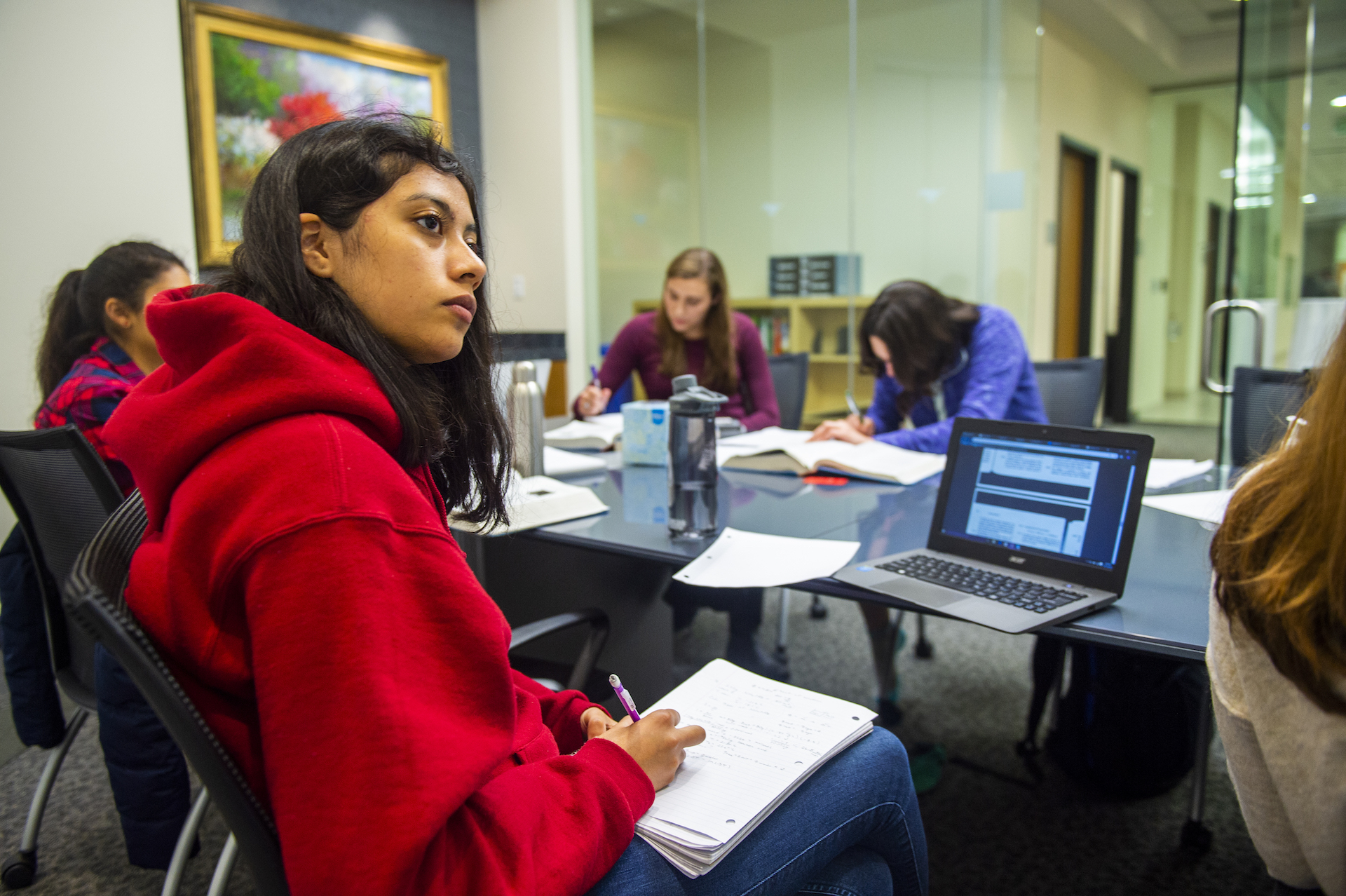 Group of students with notebooks and laptops