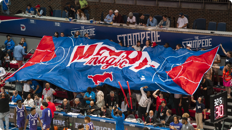 Fans with a large Moody Magic banner